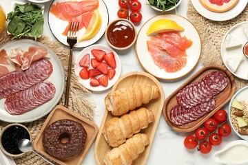 Different tasty food served for brunch on white marble table, flat lay