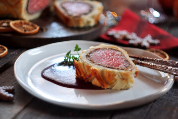 Beef Wellington - a fillet of beef tenderloin steak wrapped in puff pastry. Selective focus