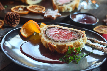 Beef Wellington - a fillet of beef tenderloin steak wrapped in puff pastry. Selective focus
