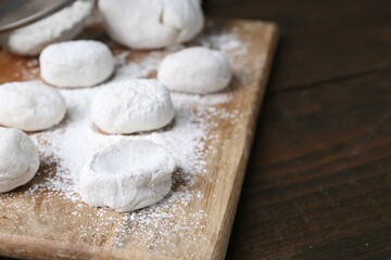 Dough for tasty homemade mochi on wooden table, closeup. Space for text