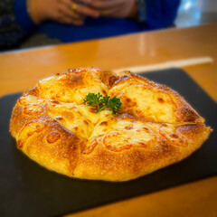Tasty, fluffy cheese bread served in an Italian restaurant