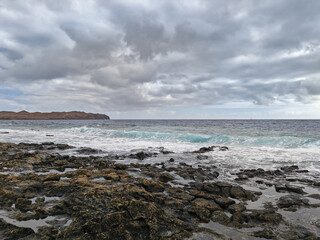 Costa Teguise seascape with mountains and dramatic skies Lanzarote Spain