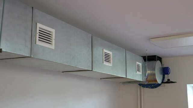 Ventilation system shaft. Chrome square pipe of a refurbished or new installed ventilation system for providing fresh air to shelters, basements or industrial areas