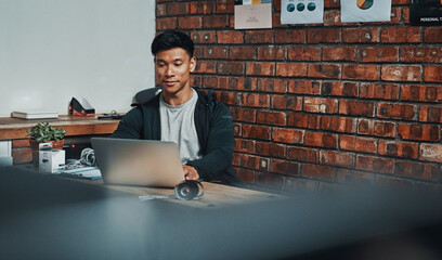 Man, fitness instructor and laptop with reading at gym for schedule, review or growth with gym subscription. Personal trainer, computer and thinking with typing to contact client with exercise plan