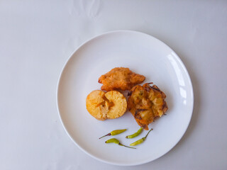 Gorengan : Fried food is one of the most popular types of snacks in Indonesia. Indonesian street food.Black background.