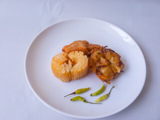 Gorengan : Fried food is one of the most popular types of snacks in Indonesia. Indonesian street food.Black background.