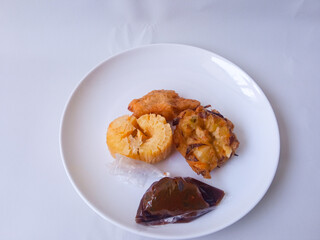 Gorengan : Fried food is one of the most popular types of snacks in Indonesia. Indonesian street food.Black background.