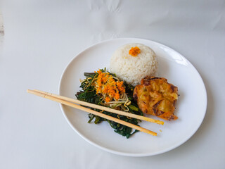 Urap Sayur. healthy and traditional indonesian food isolated on white
