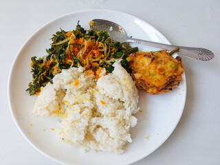 Urap Sayur. healthy and traditional indonesian food isolated on white