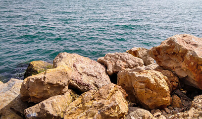 Stones on the shore of the Atlantic Ocean. Portugal, Cascais.