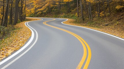 Fototapeta premium A winding road adorned with vibrant yellow ginkgo leaves in an enchanting autumn landscape