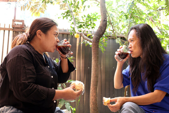 Two Indonesian Mother Ibu Rumah Tangga HouseWives Drinking Black Coffee