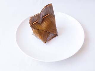 Bothok is a typical Javanese food made from grated coconut, added with chili sauce and side dishes and wrapped in banana leaves, cooked steamed.