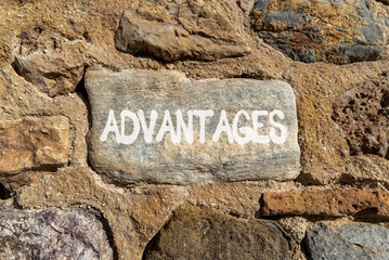 Advantages symbol. Concept word Advantages on beautiful grey volcanic stone. Beautiful red stone wall background. Business advantages concept. Copy space.
