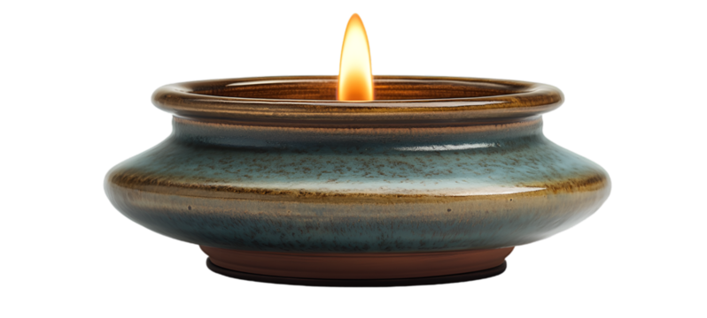  a small ceramic candle holder. The candle holder is round and has a flat base with a narrow opening at the top. The body of the candle holder has a textured surface with a blue-green color.