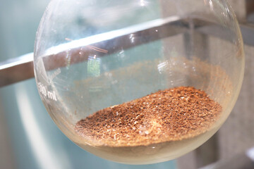 Close-up glass round bottom flask background.