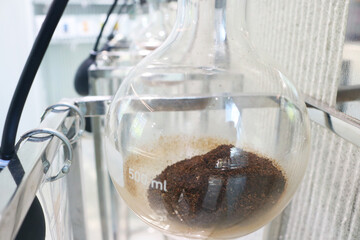Close-up glass round bottom flask for coffee barista.