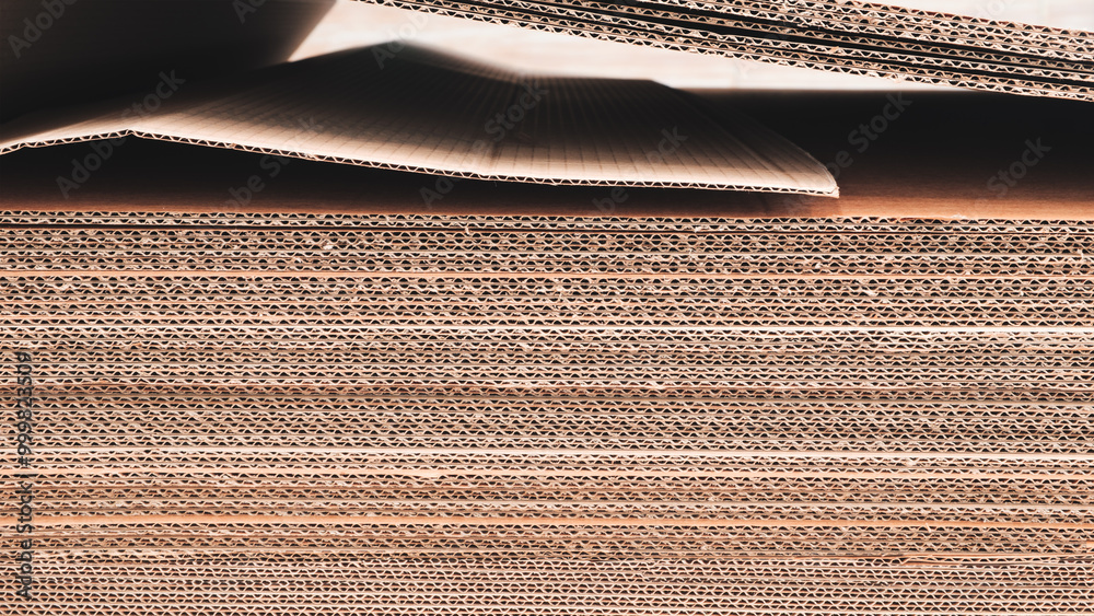 Poster A stack of brown cardboard boxes. boxes are stacked on top of each other and are brown in color