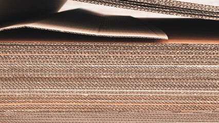 A stack of brown cardboard boxes. boxes are stacked on top of each other and are brown in color