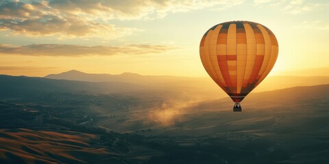 Obraz premium A vibrant hot air balloon soaring above a scenic landscape at sunset, capturing the beauty of adventure and tranquility.