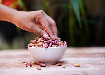 Uncooked Kidney bean or Red beans in wooden teak bowl with copy space.