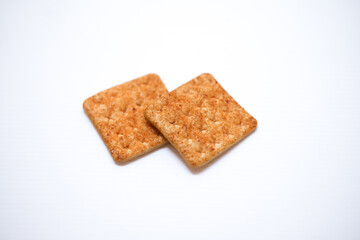 Sugar coated biscuits, sugarless healthy malkist cracker biscuits isolated on white background.