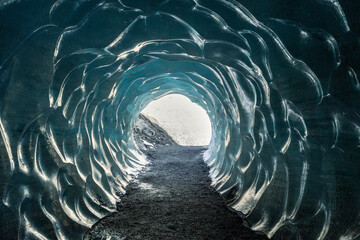 The ice cave walls carved with natural wave like patterns, Katla Ice Cave, Iceland, 