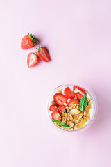 yogurt with strawberries, granola and honey