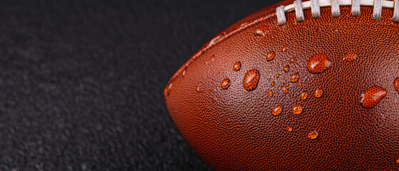 A football with water droplets on it