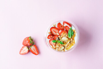 yogurt with strawberries, granola and honey