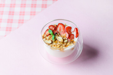 yogurt with strawberries, granola and honey