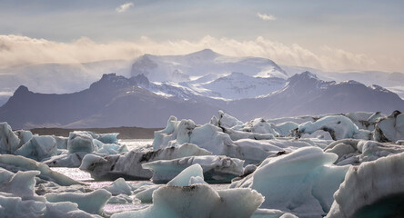panorama of hundreds of icebergs at Jökulsárlón Galcier Lagoon with the glaciers and mountains of Vatnajökull in the background, Iceland	