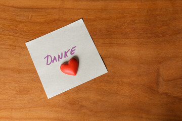 A Note of Thanks - Thank you in german language "Danke" with a red heart