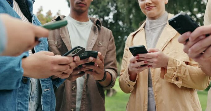 People, students and hands with phone in nature for chatting, social media or data sync at outdoor park. Closeup, young or group of friends with mobile smartphone for communication or connection