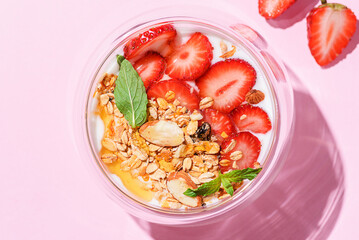 yogurt with strawberries, granola and honey