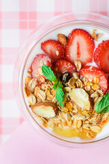 yogurt with strawberries, granola and honey