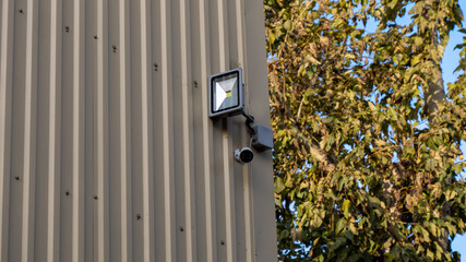 A security camera is mounted on a building