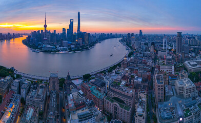 Aerial view of modern city skyline and buildings at sunrise in Shanghai