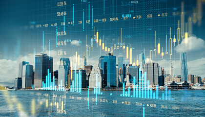 Double exposure of New York City skyline with financial charts and graphs on blue background.