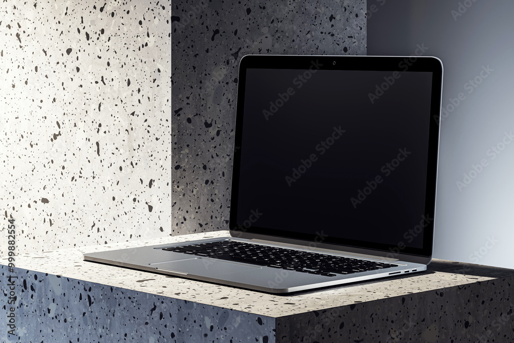 Poster modern laptop with blank screen on speckled concrete pedestal. 3d rendering