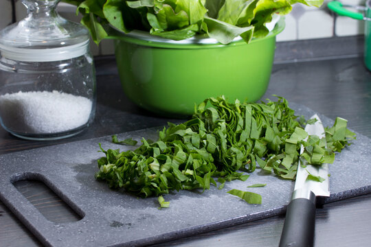 freshly sliced sorrel lies with a knife on a cutting board. close-up