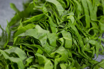 freshly sliced sorrel lies with a knife on a cutting board. close-up