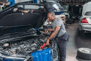 Professional Auto Technician Servicing Car Air Conditioning