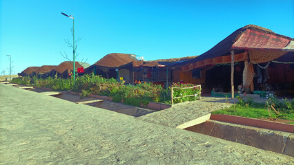 Obraz premium Row of traditional berber tents serving as a restaurant in Aguelmam Azegza, khenifra Morocco