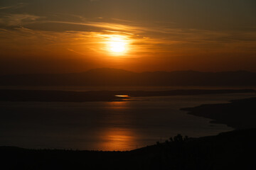 Obraz premium The sunset bathes the Croatian Adriatic coast in orange color.