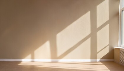 Obraz premium Light on the background wall. Shadow from the window and sunlight. White rays of the sun in a bright empty room. Shade overlay. Modern studio in beige tones. interior of a room with a window