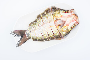 A fresh white fish on a plate