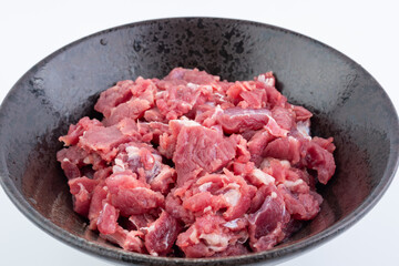 A bowl of fresh beef brisket slices