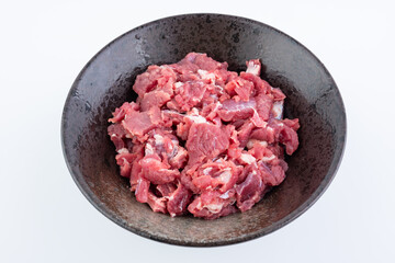 A bowl of fresh beef brisket slices