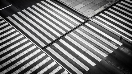 Obraz premium High angle view of black and white street with white crosswalk